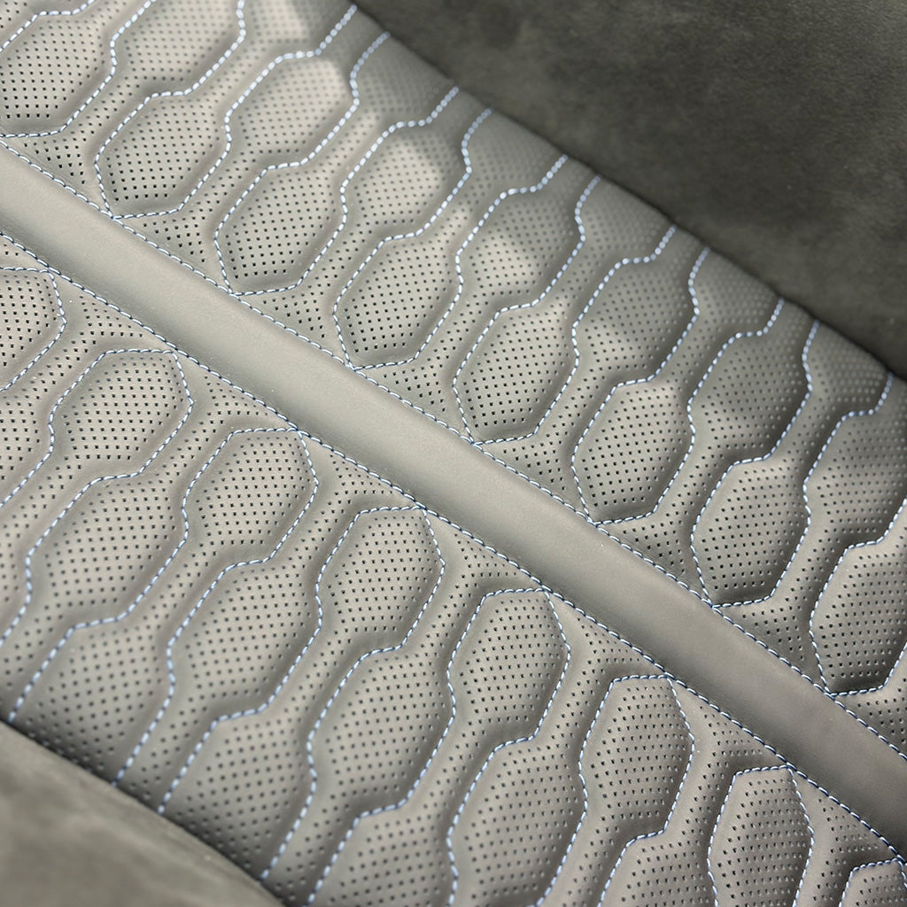 Audi RS Carbon Bucket Seats upholstery macro – perforated gray Alcantara with custom organic stitched quilting pattern close-up