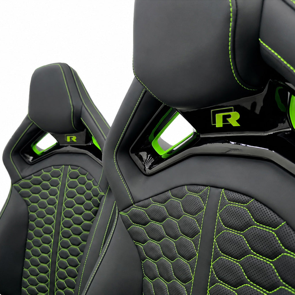 Audi RS Sport Bucket Seats green edition shoulder bridge detail – gloss black bridge with neon green accent inserts and green R badge close-up