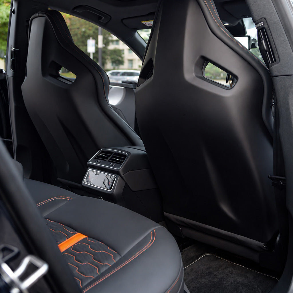 Audi RS Sport Bucket Seat cabin view – rear door perspective showing front passenger seat with orange accent stripe and orange contrast stitching