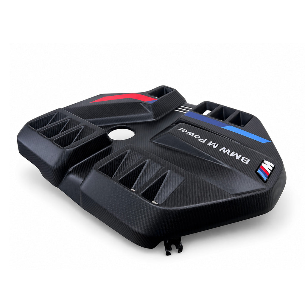 BMW G8X M2 M3 M4 S58 EVE carbon fiber engine cover low angle showing aggressive scoop vents and M tricolor strip