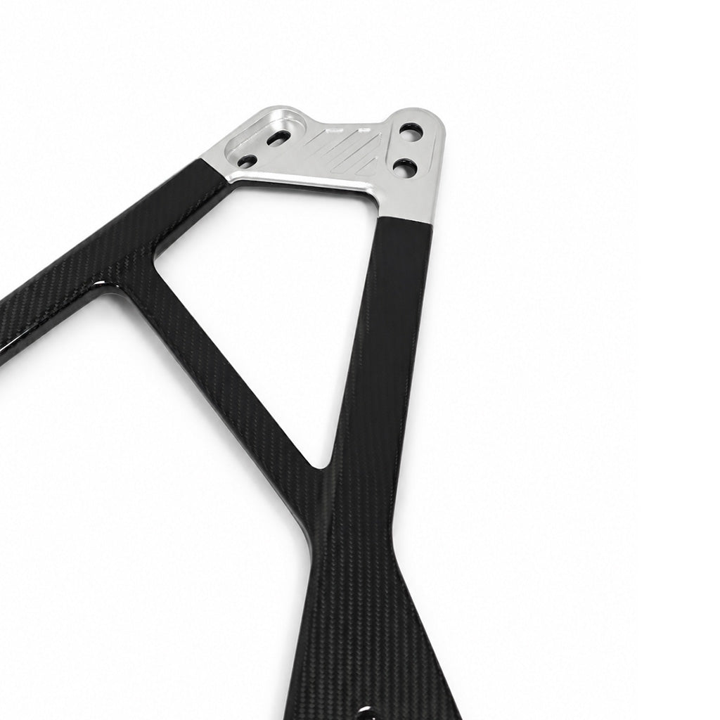 Silver CNC center bracket and carbon fiber arms of the BMW G80 M3 G82 M4 G87 M2 CSL style engine bay strut bar