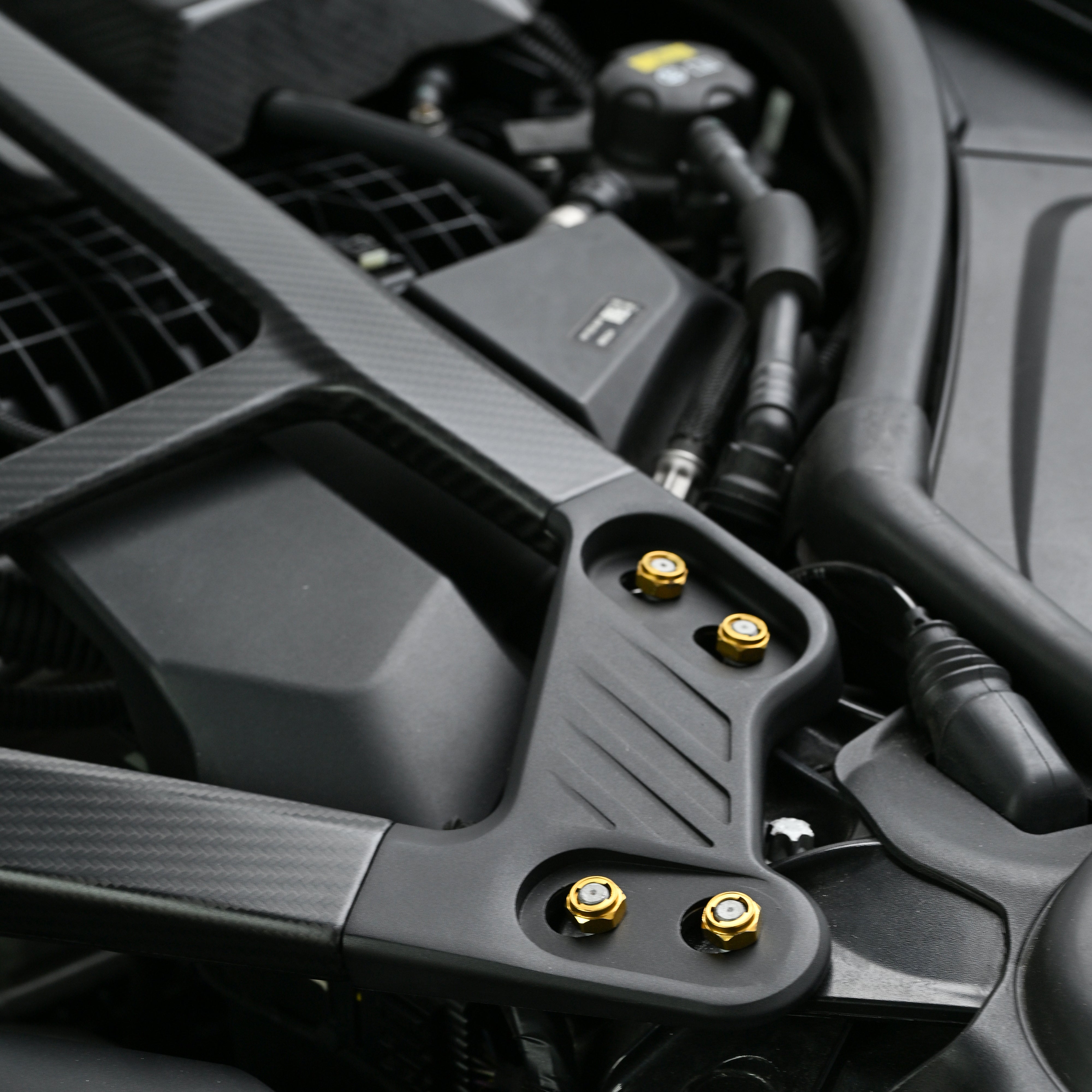 CSL style carbon fiber strut bar for the BMW G80 M3 G82 M4 G87 M2 spanning the strut towers