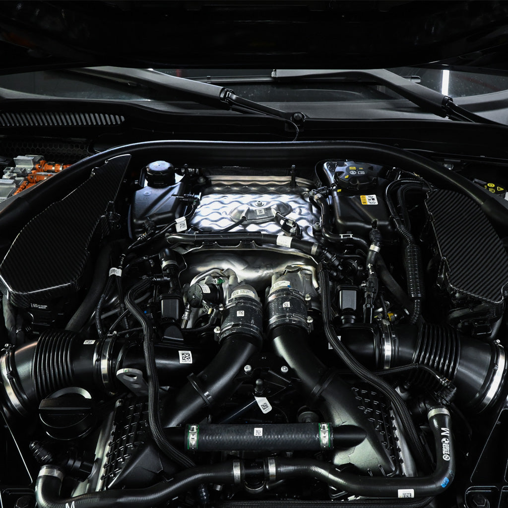 BMW G90 M5 dry carbon fiber ECU battery terminal cover by CarbonXtreme