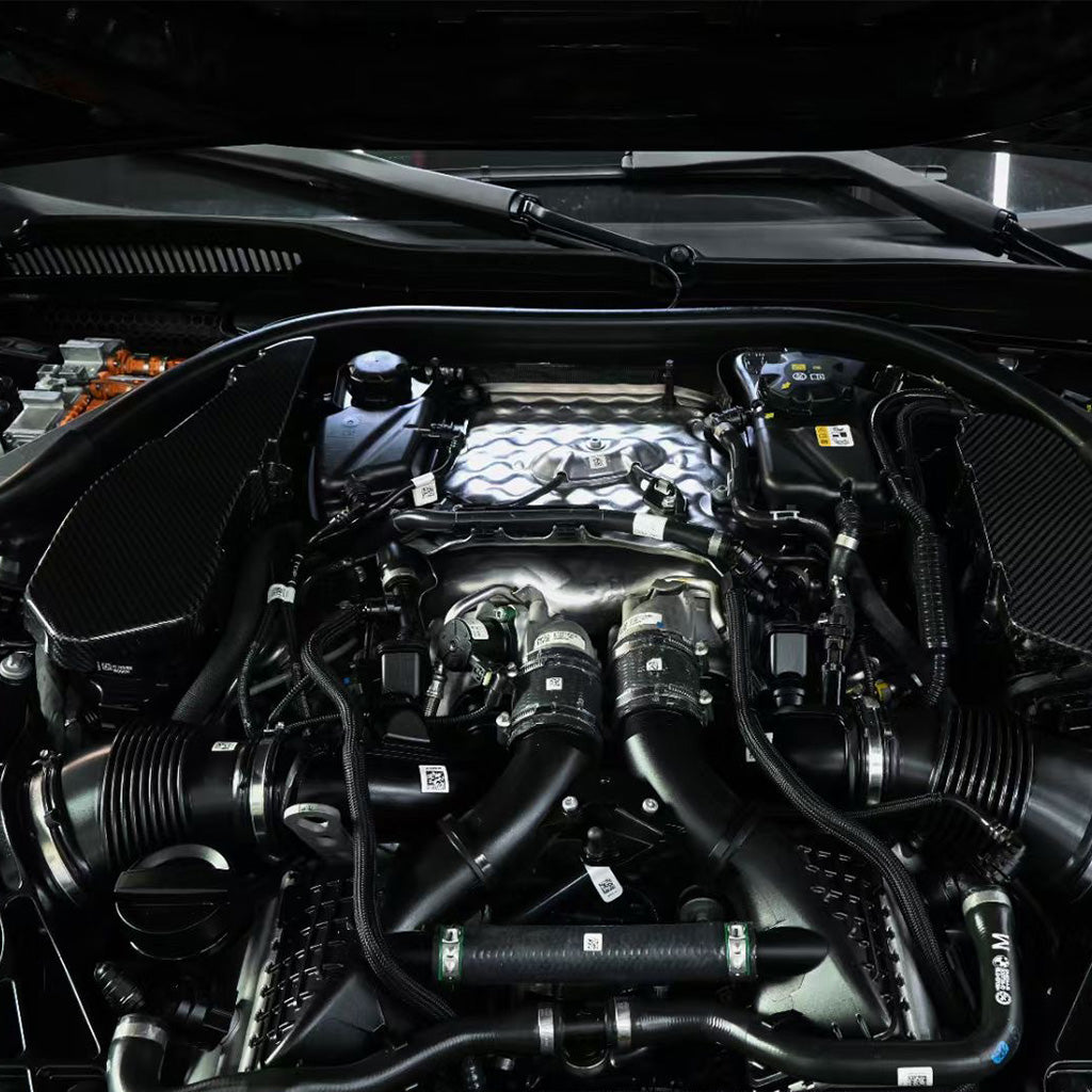BMW G90 M5 full carbon fiber engine bay set with mesh, battery cover, radiator cap, and engine shroud by CarbonXtreme