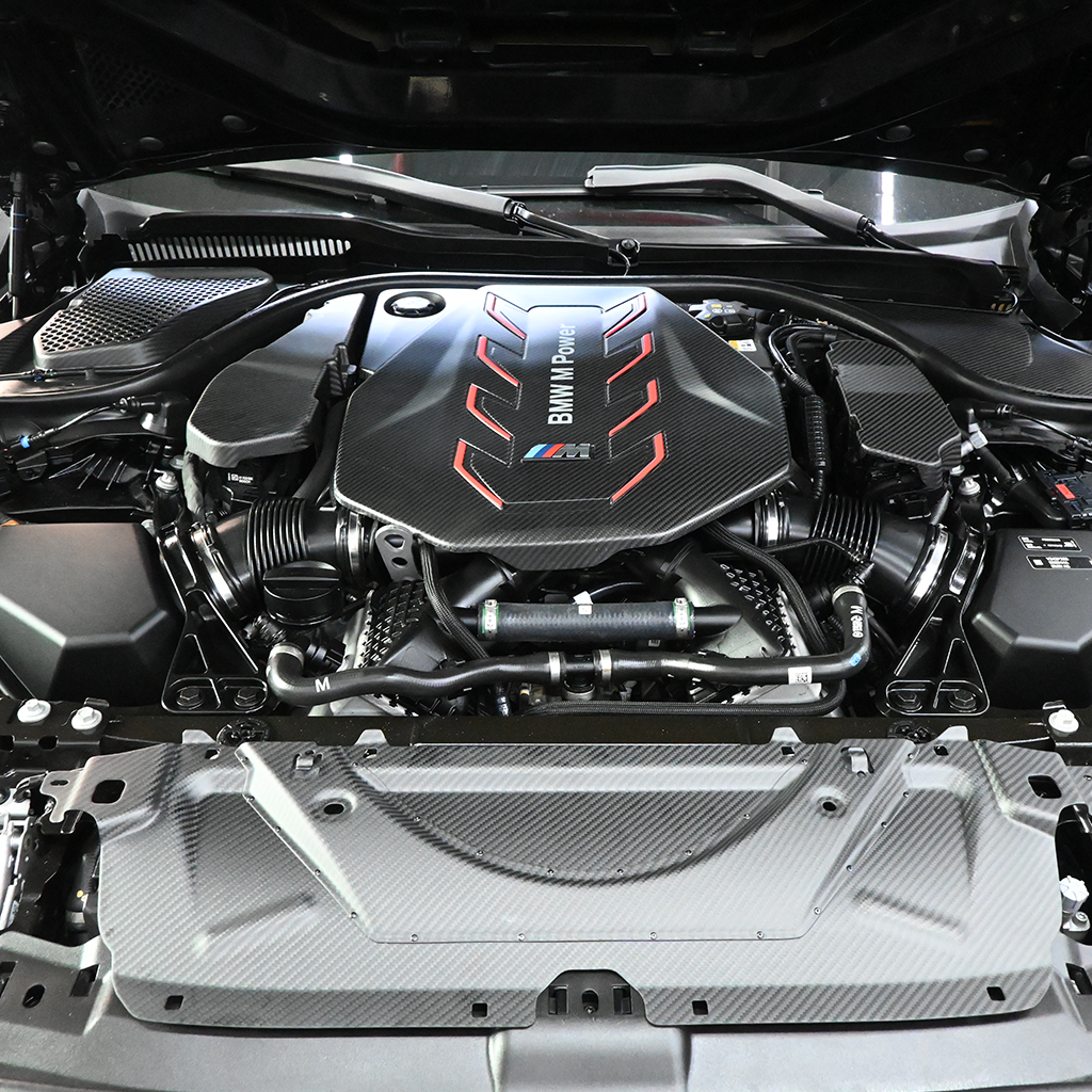 BMW G90 M5 full carbon fiber engine bay set with mesh, battery cover, radiator cap, and engine shroud by CarbonXtreme