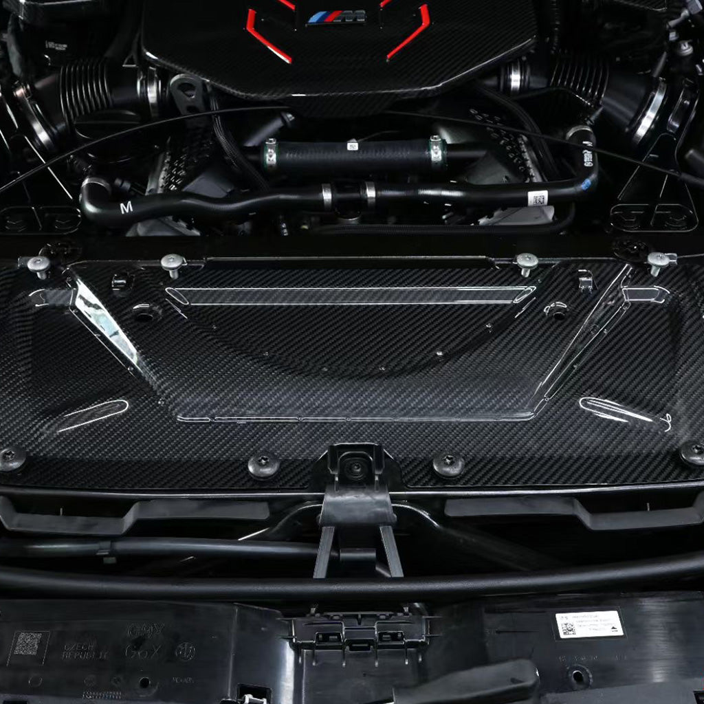 BMW G90 M5 full carbon fiber engine bay set with mesh, battery cover, radiator cap, and engine shroud by CarbonXtreme