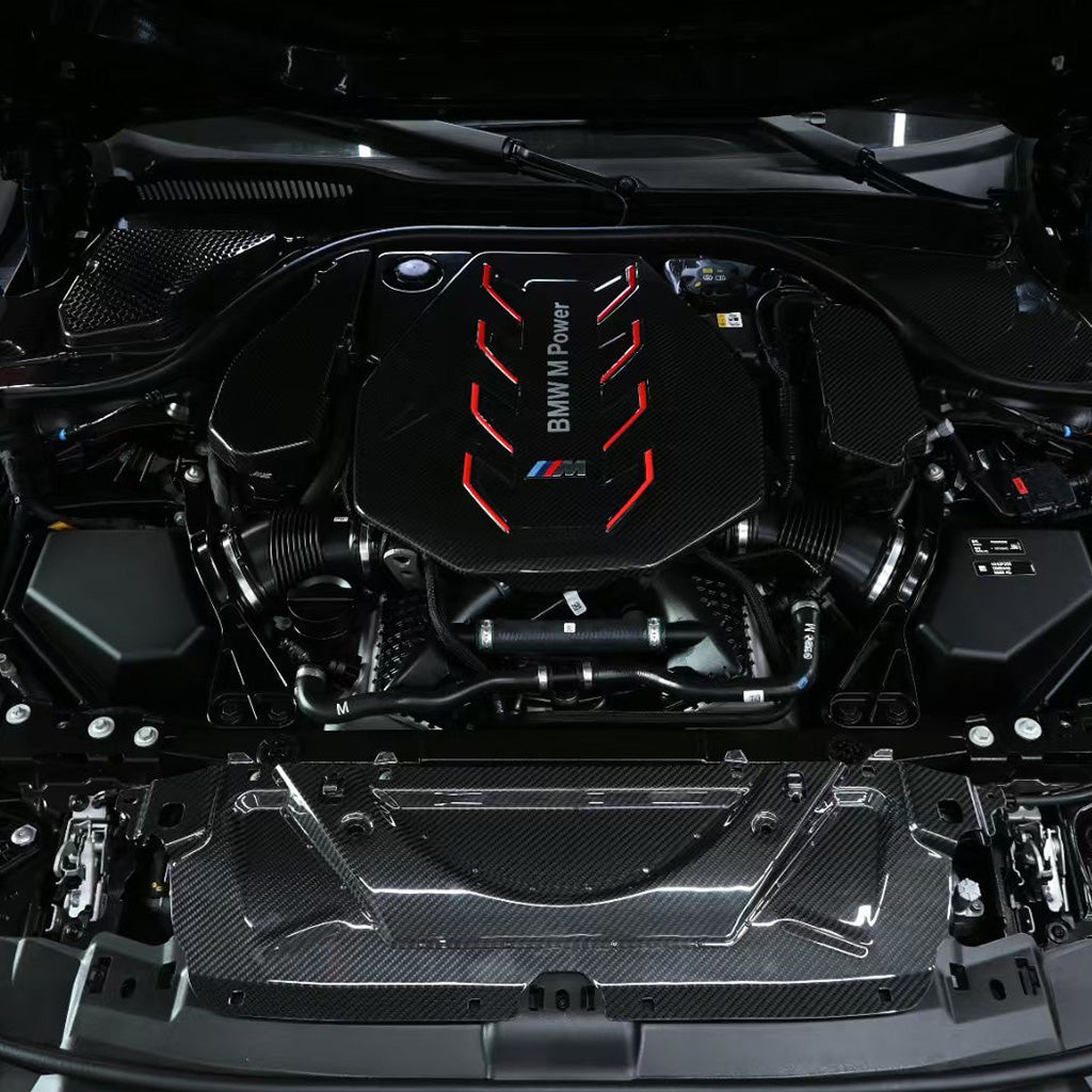 BMW G90 M5 full carbon fiber engine bay set with mesh, battery cover, radiator cap, and engine shroud by CarbonXtreme