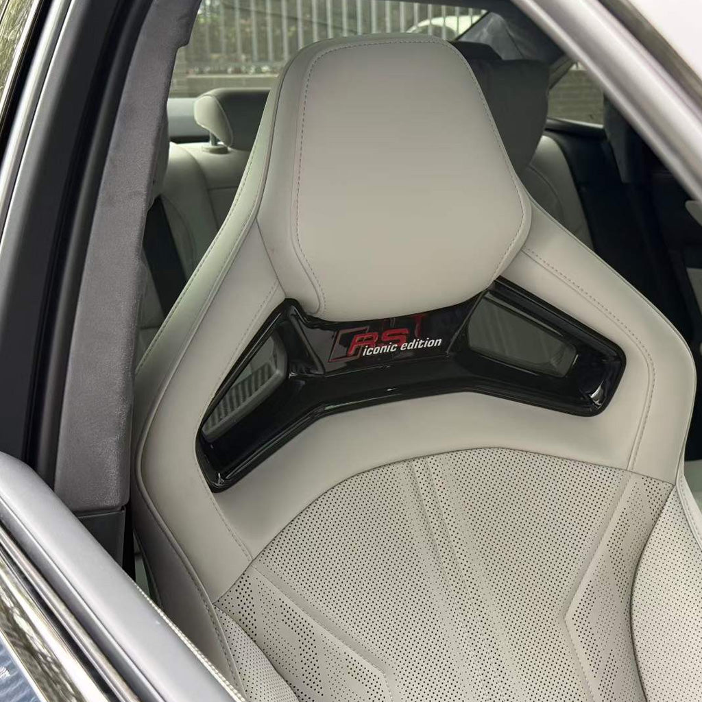 Audi RS white bucket seat detail – perforated leather with bespoke custom quilting pattern, aftermarket tailored upholstery