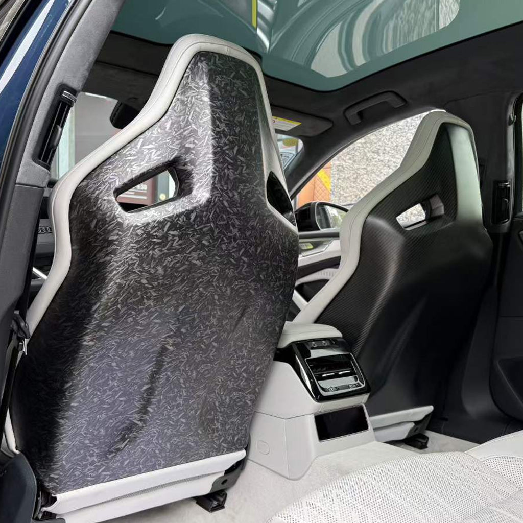 Audi RS white bucket seats with matte forged carbon fiber backshell installed in white Audi luxury interior