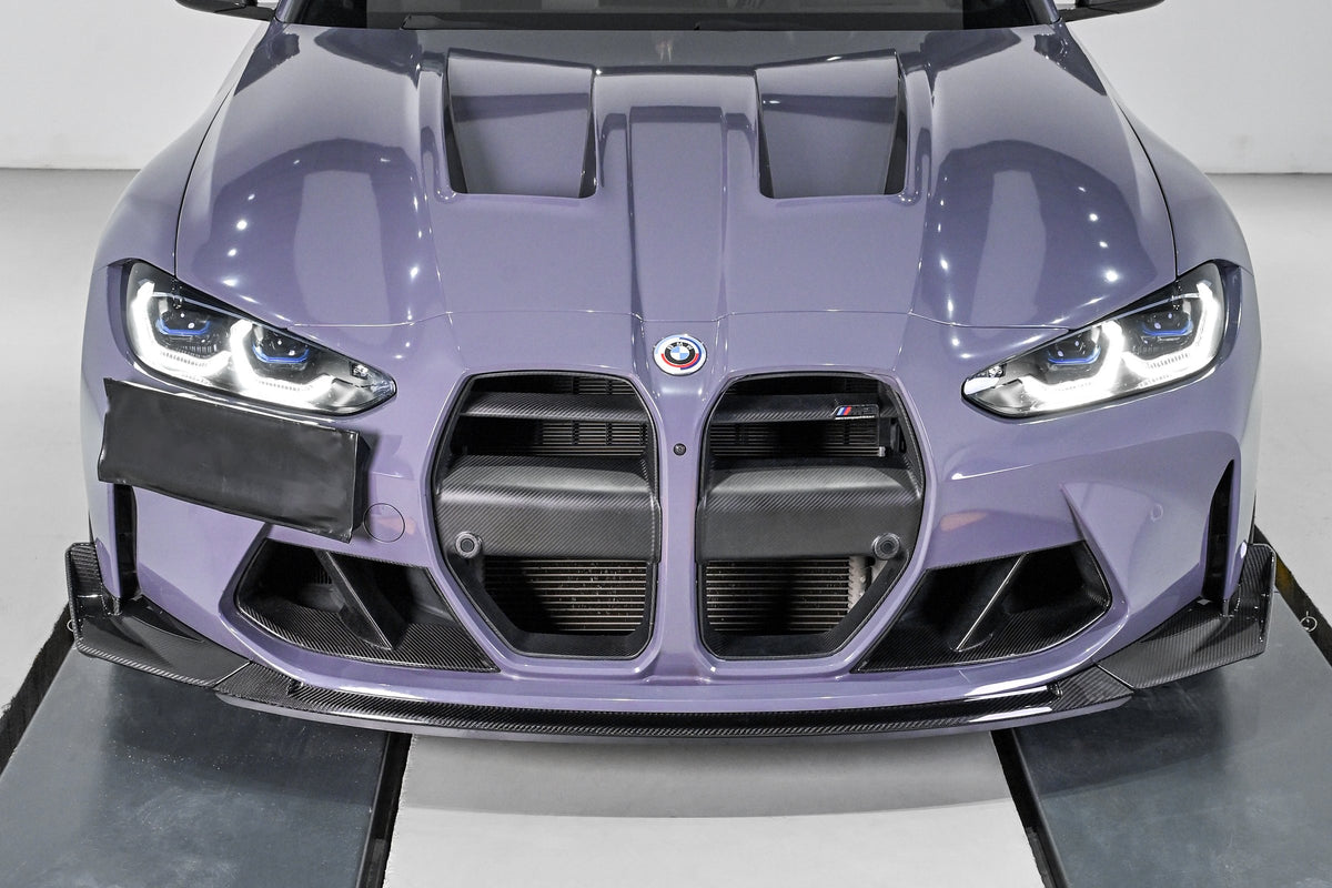 BMW G82 M4 front bumper fitted with the CSL style carbon fiber front lip and corner splitters