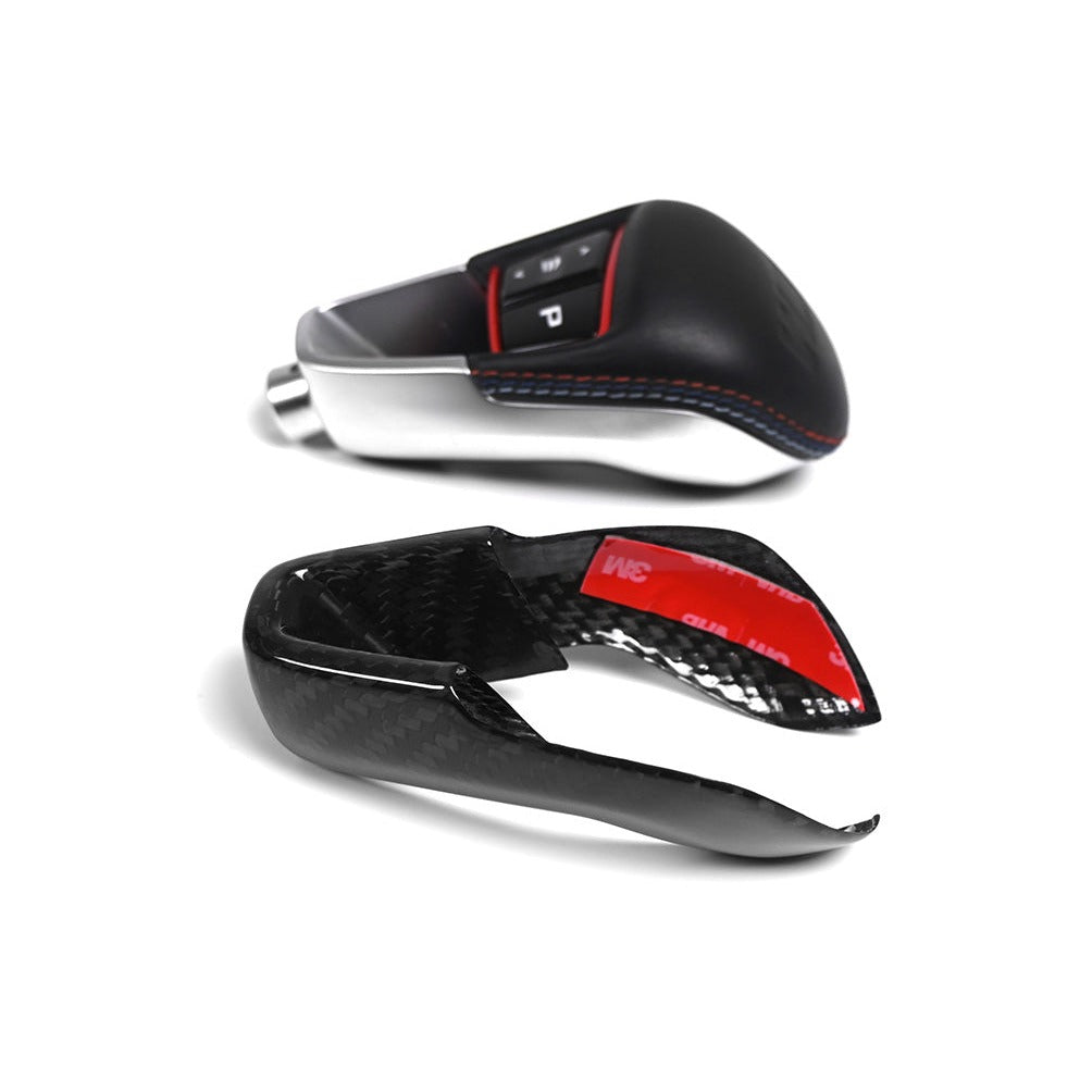 BMW M gear selector next to the two piece carbon fiber cover with pre applied 3M adhesive