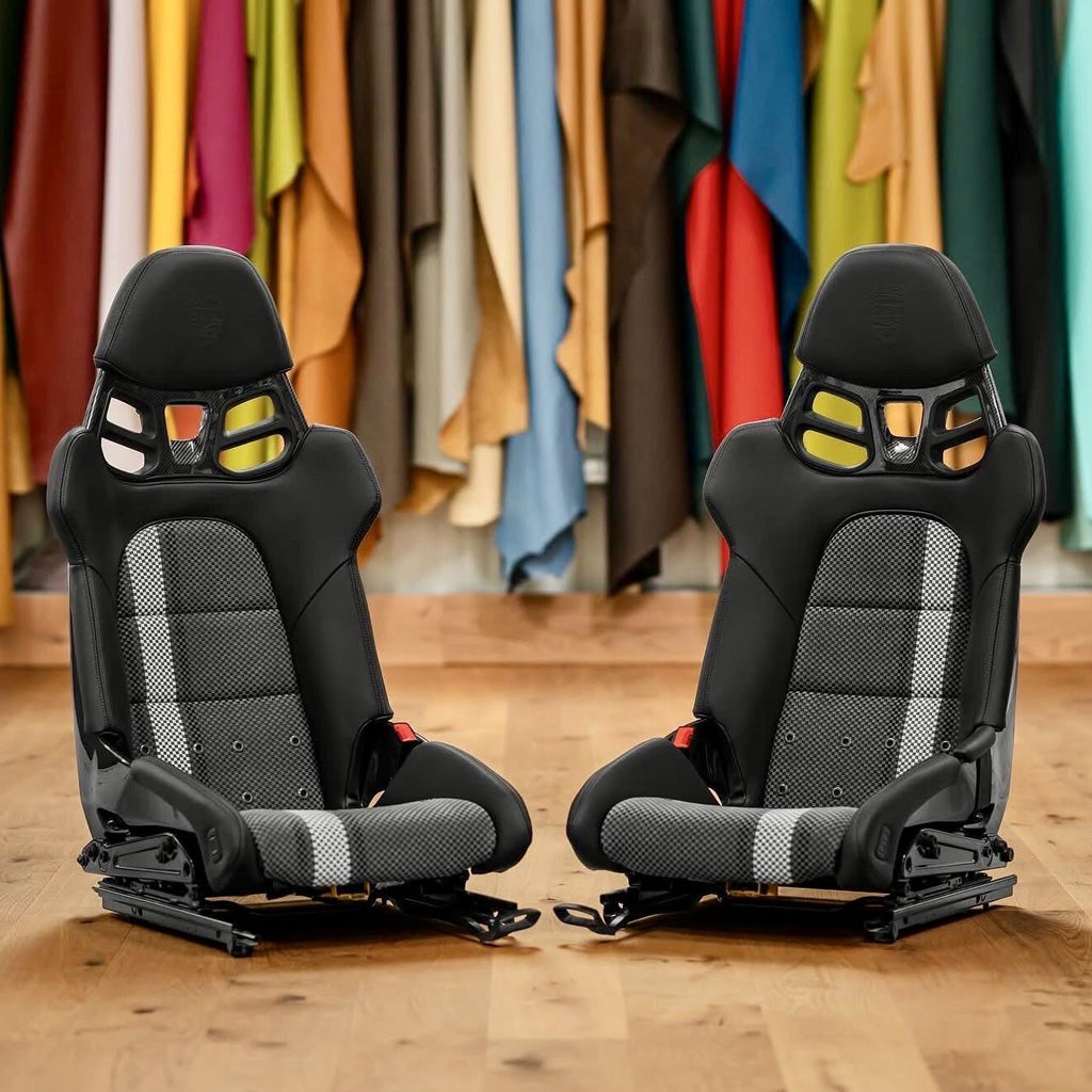 Porsche 918 style carbon fiber full bucket seats shown as a pair, black leather with carbon-weave center panels and white stripe, front view