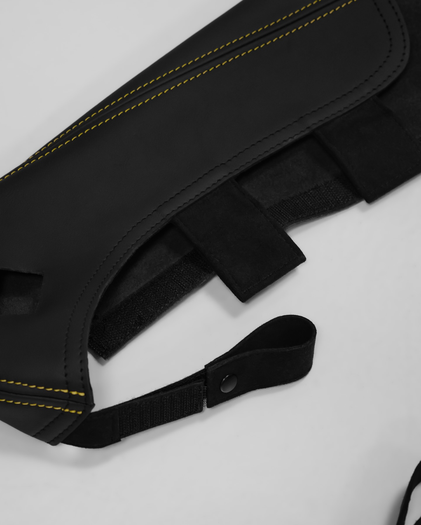 Single Porsche bucket seat bolster protector, black leather, yellow stitching, elastic strap fit