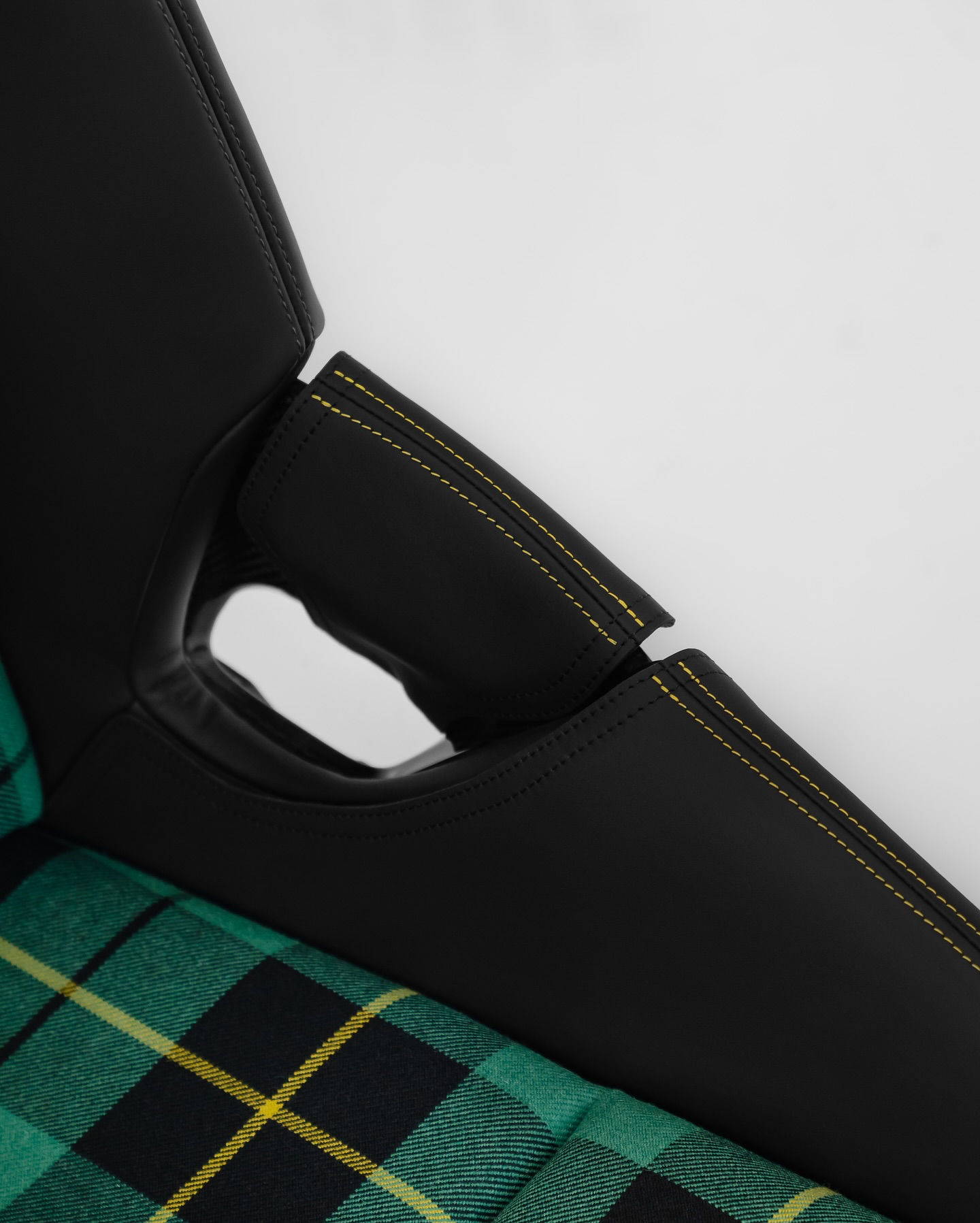 Porsche folding bucket seat bolster protector in black leather over green tartan, handmade Germany