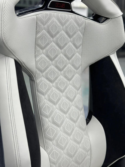 BMW M Carbon Fiber Bucket Seat backrest with illuminated headrest emblem and M8-style diamond quilted leather