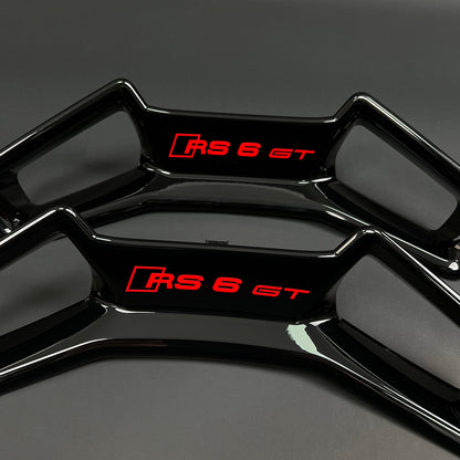 Audi RS6 GT headrest trim panel pair – gloss black with RS6 GT badge in red, RS and RS6 GT variants side by side
