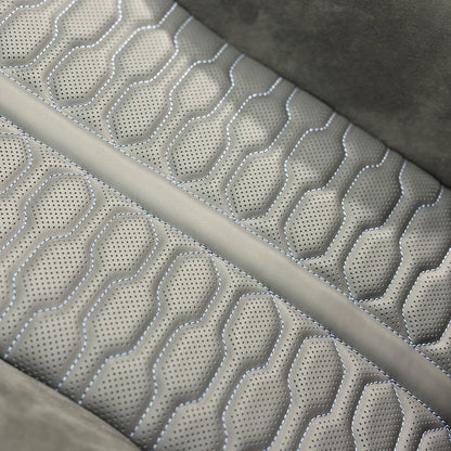 Audi RS Carbon Bucket Seats upholstery macro – perforated gray Alcantara with custom organic stitched quilting pattern close-up