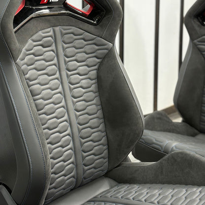 Audi RS bucket seats backrest angle – honeycomb quilted gray Alcantara with RS headrest badge and matching passenger seat