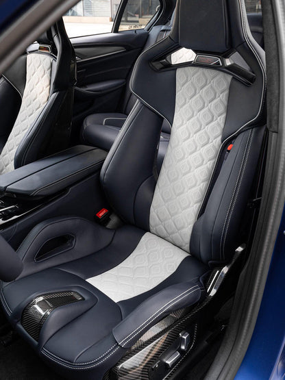 BMW M5 F90 Carbon Fiber Bucket Seats in navy and white two-tone diamond quilted leather, bespoke custom interior with carbon shells, three-quarter view