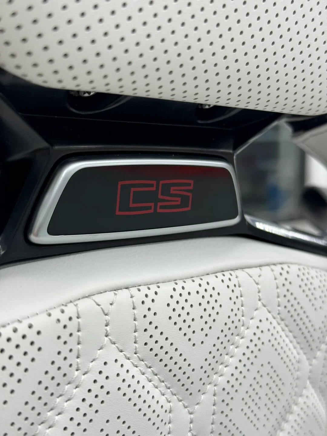 BMW M Carbon Fiber Bucket Seat illuminated headrest emblem, macro detail