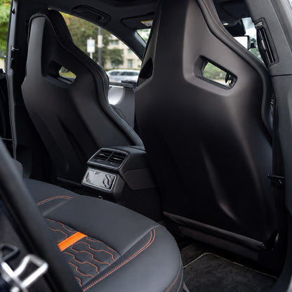 Audi RS Sport Bucket Seat cabin view – rear door perspective showing front passenger seat with orange accent stripe and orange contrast stitching