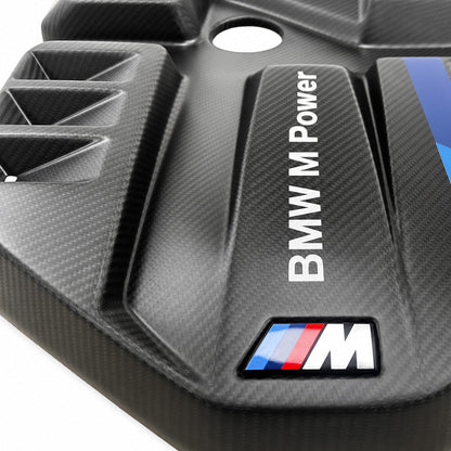 Macro of BMW G8X S58 EVE carbon fiber engine cover, BMW M Power lettering and M badge on the carbon weave