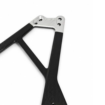 Silver CNC center bracket and carbon fiber arms of the BMW G80 M3 G82 M4 G87 M2 CSL style engine bay strut bar