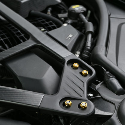 CSL style carbon fiber strut bar for the BMW G80 M3 G82 M4 G87 M2 spanning the strut towers