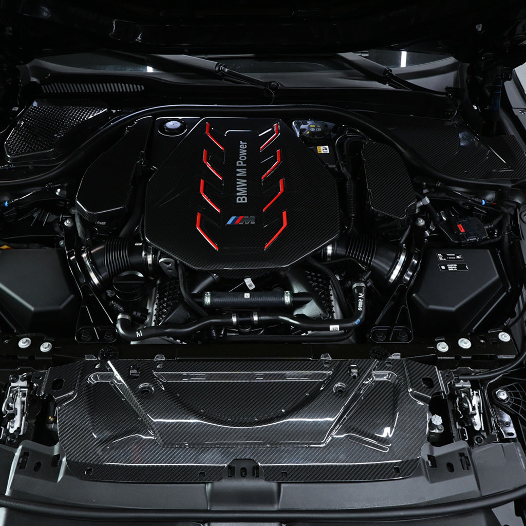 BMW G90 M5 full carbon fiber engine bay set with mesh, battery cover, radiator cap, and engine shroud by CarbonXtreme