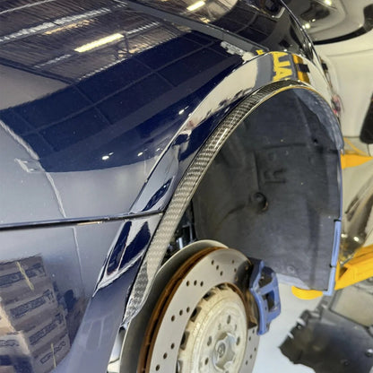 BMW G80 M3 carbon fiber wheel arch trim with OE mount or 3M adhesive installation by CarbonXtreme
