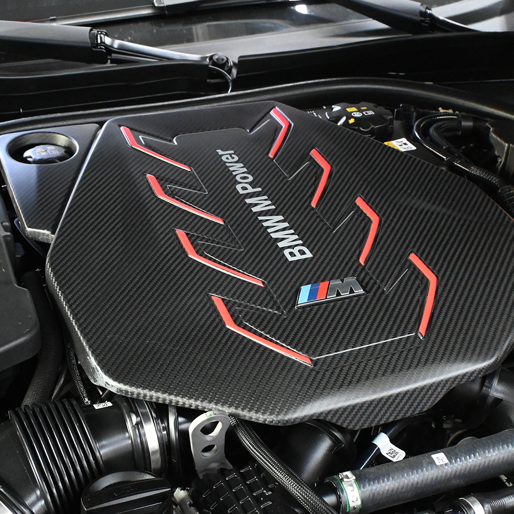 BMW G90 M5 full carbon fiber engine bay set with mesh, battery cover, radiator cap, and engine shroud by CarbonXtreme