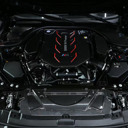 BMW G90 M5 full carbon fiber engine bay set with mesh, battery cover, radiator cap, and engine shroud by CarbonXtreme
