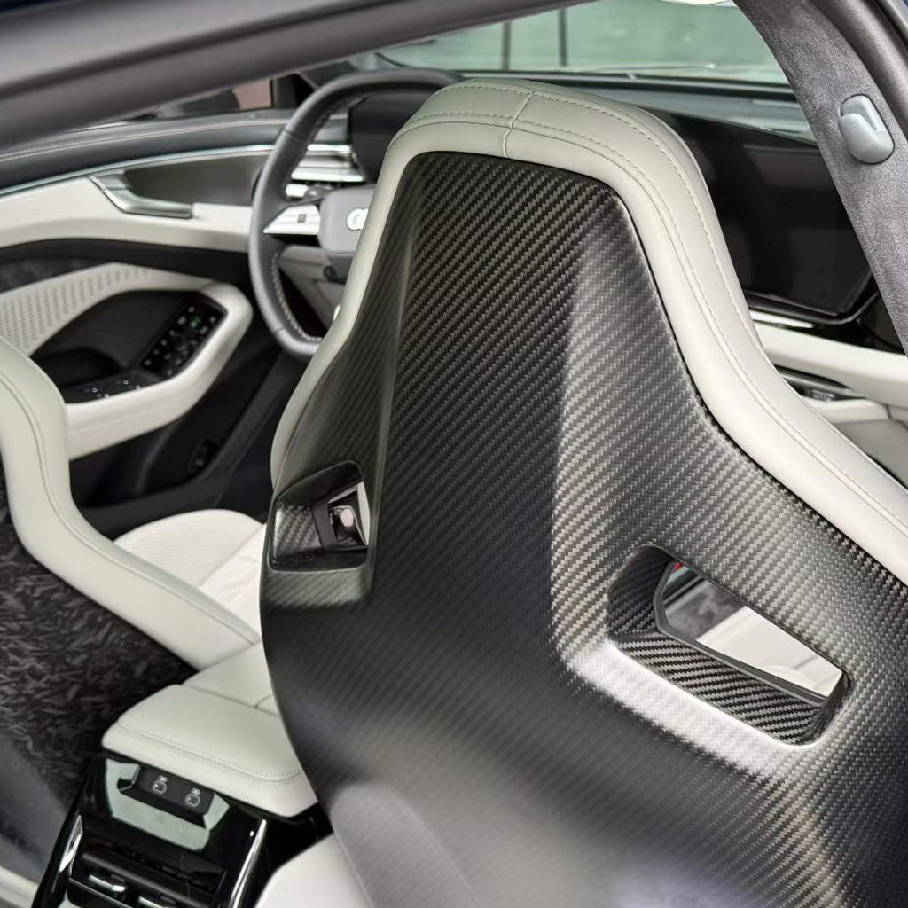 Audi RS white bucket seats rear view – matte dry carbon fiber backshell panel detail in white luxury Audi interior
