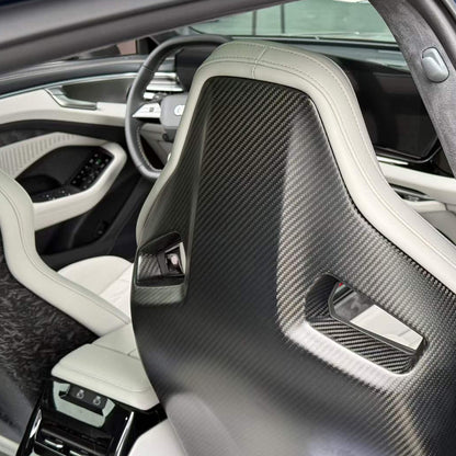Audi RS white bucket seats rear view – matte dry carbon fiber backshell panel detail in white luxury Audi interior