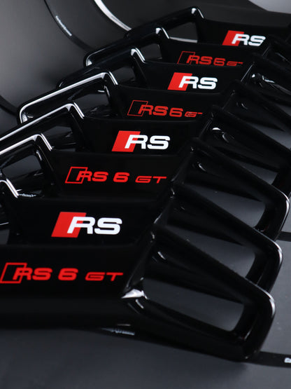 Audi RS headrest trim panel pair, OEM sourced version next to CarbonXtreme custom made version