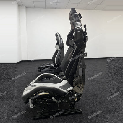 BMW M carbon fiber bucket seat, side profile showing the seat frame, rails and adjustment hardware