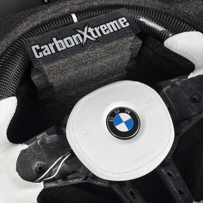 Twill carbon fiber top rim with white 12 o'clock stripe on the custom BMW steering wheel
