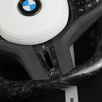 Forged carbon fiber flat bottom section of the custom BMW steering wheel