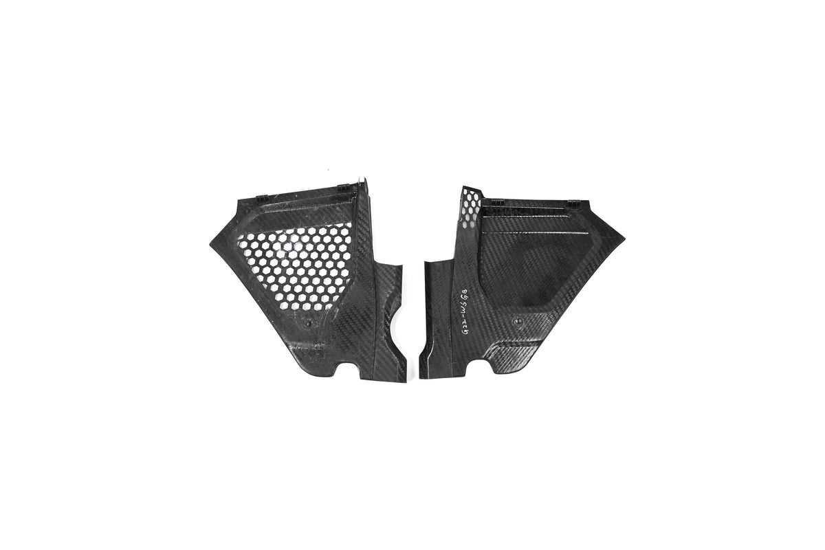 BMW G22 4 Series carbon fiber engine bay corner panels are shown from the underside with their edges aligned.