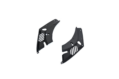 BMW G22 4 Series carbon fiber headlight cover panels sit diagonally on white with the right panel closer.