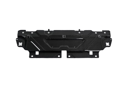 BMW G22 4 Series carbon fiber slam panel cover sits horizontally on white with its mounting holes visible.