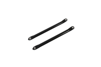 BMW G22 4 Series carbon fiber strut brace bars run diagonally upward to the right with metal end sleeves visible.