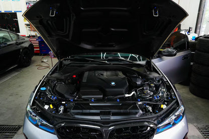 BMW G22 4 Series titanium engine bay bolt kit is shown installed, with blue heads across the open engine bay.
