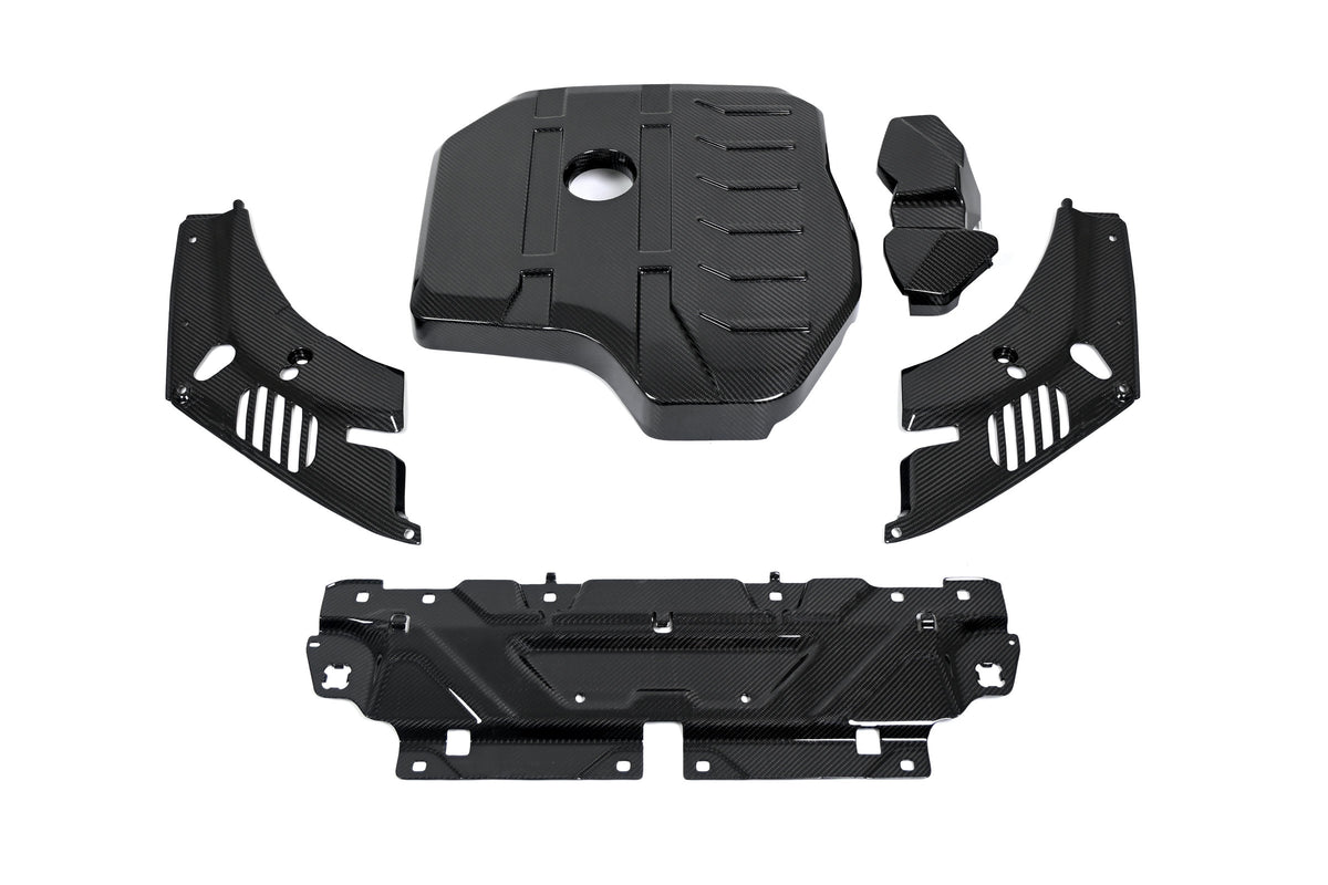 BMW 4 Series engine bay carbon fiber covers are shown from above with the slam panel cover across the front.