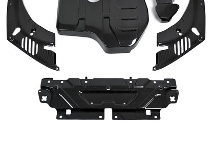 BMW 4 Series engine bay carbon fiber covers are shown close up with the slam panel cover below the slotted panels.