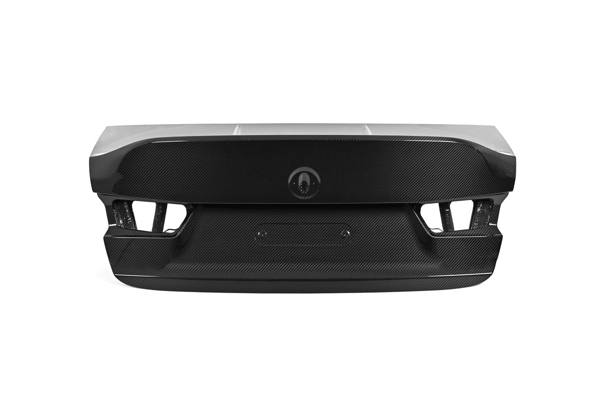 BMW G80 M3 CSL style carbon fiber trunk lid in gloss carbon, rear view with integrated ducktail