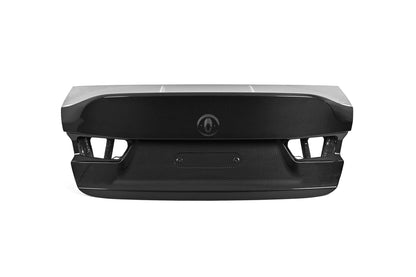 BMW G80 M3 CSL style carbon fiber trunk lid in gloss carbon, rear view with integrated ducktail