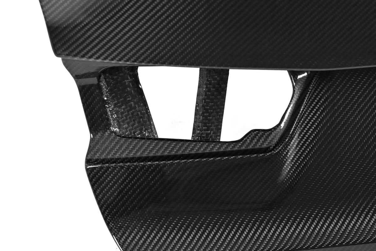 Close-up of the carbon fiber weave around the taillight opening on the G80 M3 CSL style trunk lid