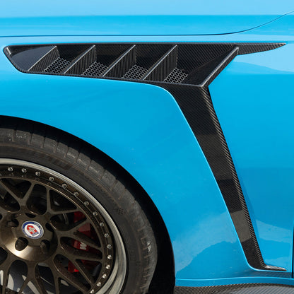 BMW G80 M3 G82 M4 SQ style front fender side vent close-up on blue G80 M3