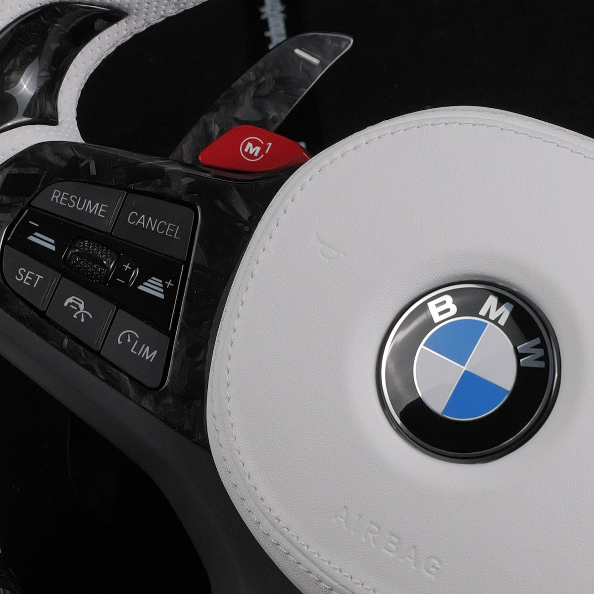 M1 button and left-hand steering wheel controls, shown on one of our custom steering wheels